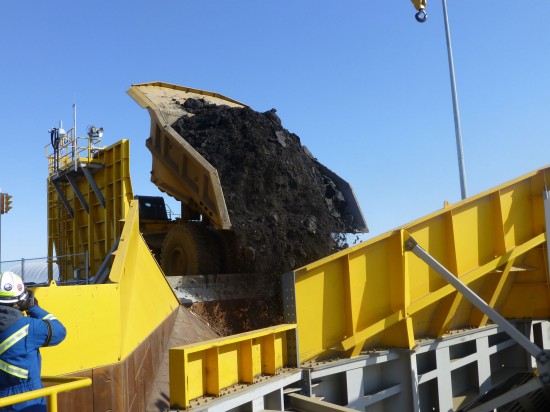 The first load of oil-sands ore at Kearl is dumped into the crusher. (CNW Group/Imperial Oil Limited)