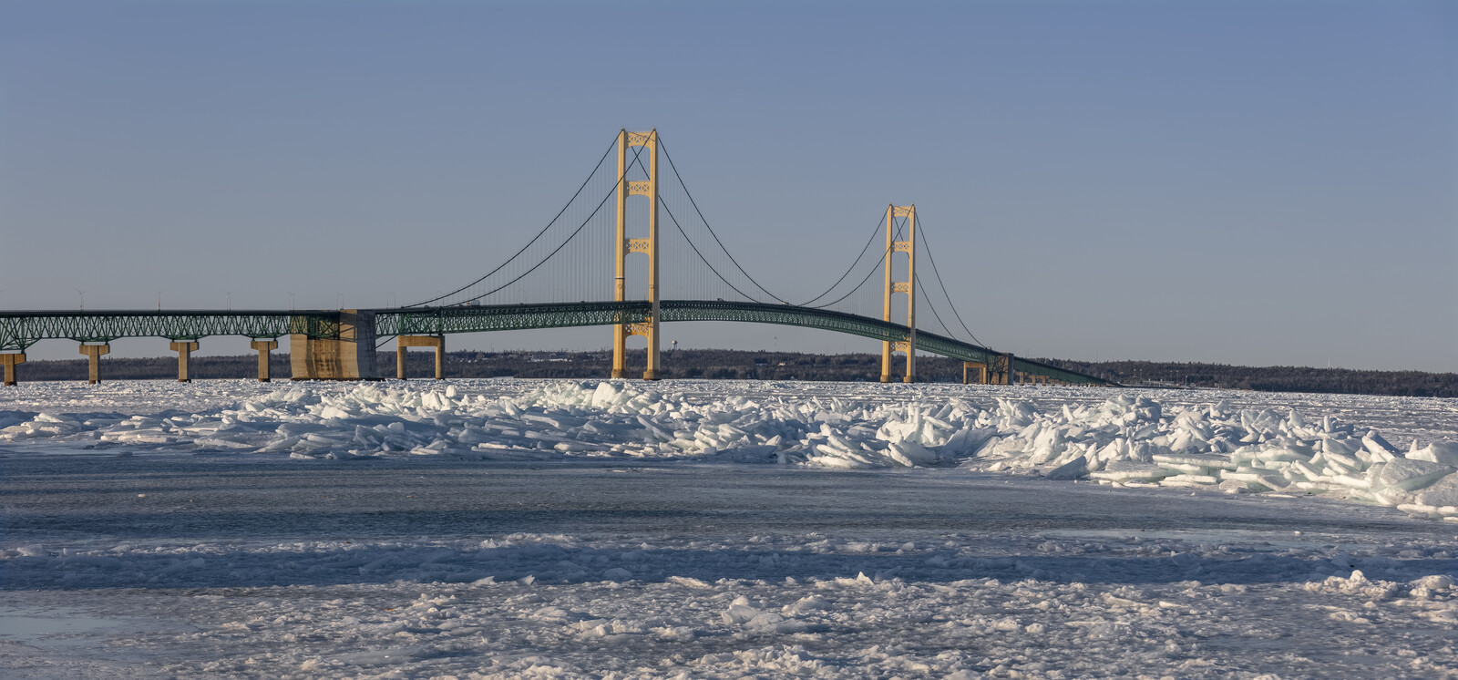 Mackinac Bridge spanning a frozen Straits of Mackinac in Michigan.